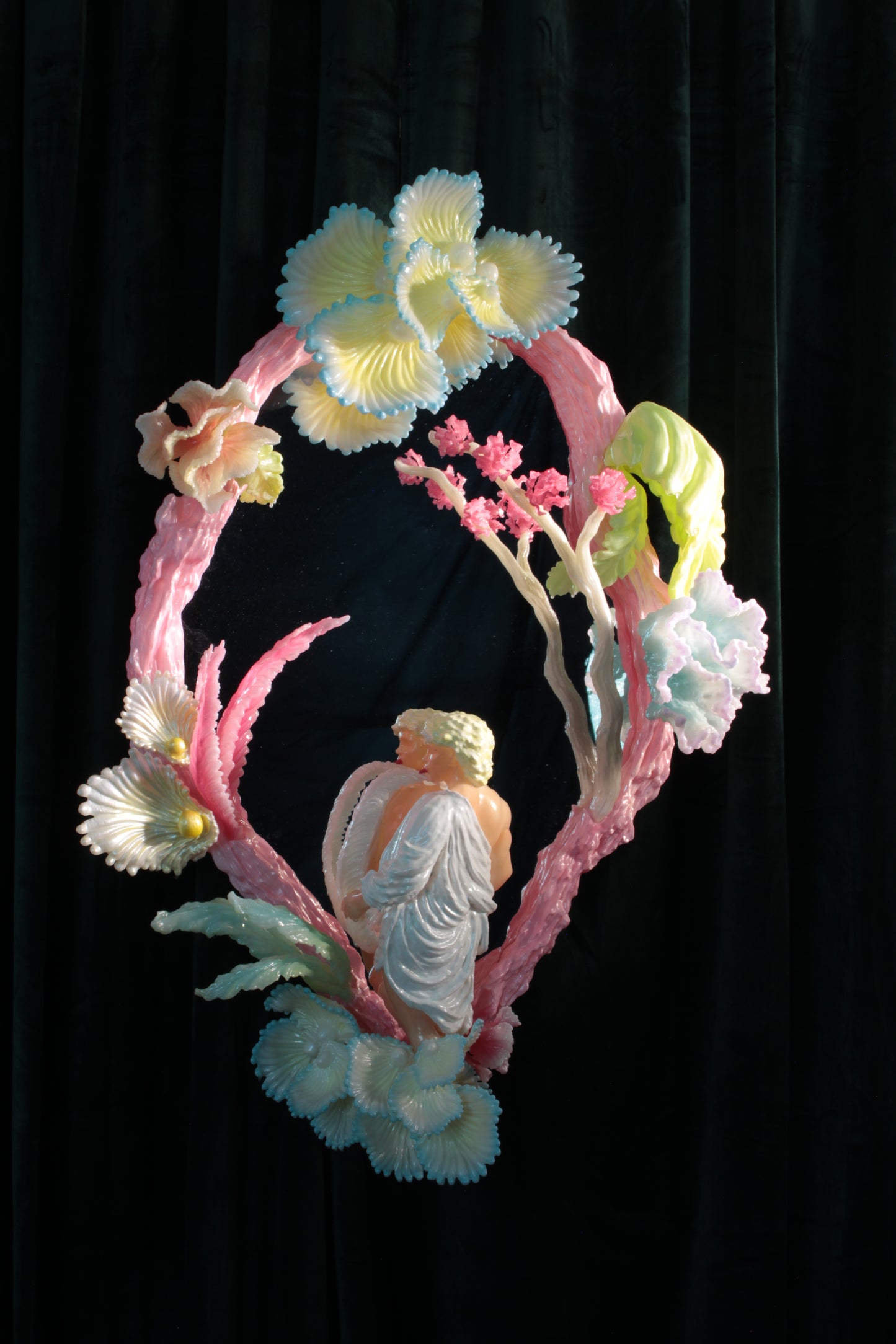 Licking leaves in the Garden — wall sculpture by Teemu Salonen, male figure before mirror with organic flowers, 2026