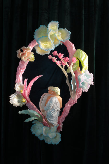 Licking leaves in the Garden — wall sculpture by Teemu Salonen, male figure before mirror with organic flowers, 2026